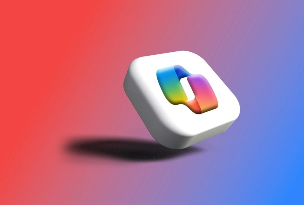 A white cube with a colorful abstract shape inside